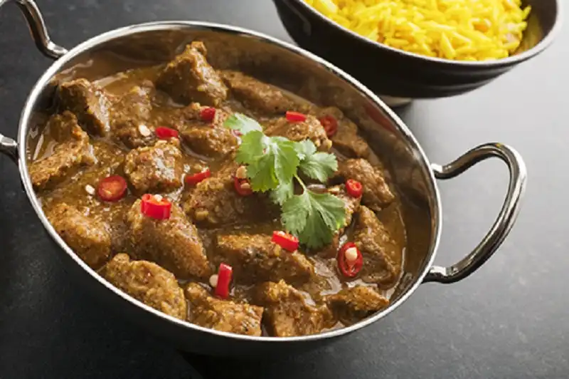 Indian Meal Food Cuisine Curry Pork Vindaloo in Balti Dish