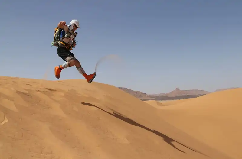 A competitor runs on a dune during the 28th edition of the "Marathon des Sables", some 300 kms south of Ouarzazate. The 223,8 kms Desert Marathon is considered as the hardest in the world. About 1024 participants, from 45 nationalities and aged 20 to 76, have to walk during seven days in the Moroccan Sahara and carry all their equipment and food on their backs. (Pierre Verdy/Getty Images)