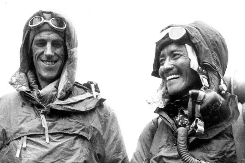 Sir Edmund Hillary (L) and Tenzing Norgay Sherpa display their climbing gear at the British Embassy in Kathmandu following their conquest of Mount Everest in 1953 in this undated handout photograph. Nepali Sherpa friends of Sir Hillary, who died on January 11, 2008, lit butter lamps and offered special Buddhist prayers in monasteries for the mountaineer, calling him a great philanthropist and friend of Nepal. Hillary, who scaled Mount Everest in 1953 along with Nepal's Tenzing Norgay Sherpa, spent much of his life afterwards helping Sherpa communities in Nepal, including projects to build hospitals and schools. REUTERS/Picture Norgay Archive/Handout (NEPAL). EDITORIAL USE ONLY. NOT FOR SALE FOR MARKETING OR ADVERTISING CAMPAIGNS. - RTX5GOK
