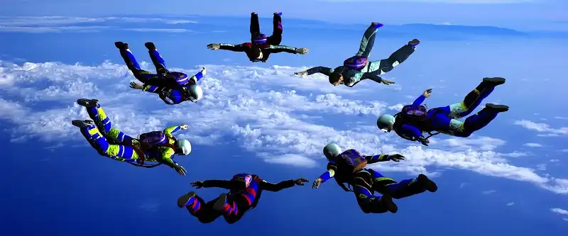 Sportsmen-parashutist soaring in sky