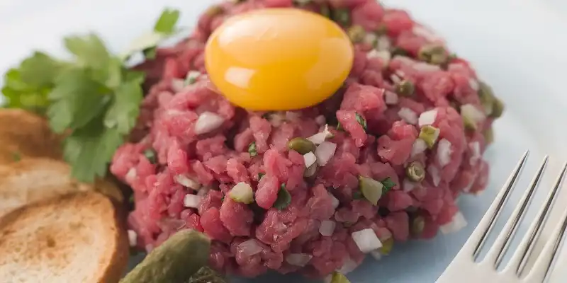 Steak Tartare with Cornichons, Croutons and an Egg Yolk