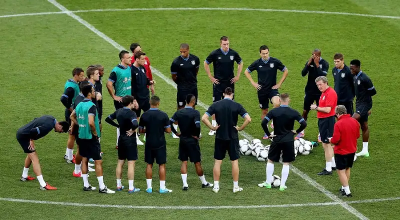 KIEV, UKRAINE - JUNE 14: England manager Roy Hodgson speaks to the team during a UEFA EURO 2012 training session at the Olympic Stadium on June 14, 2012 in Kiev, Ukraine. (Photo by Scott Heavey/Getty Images)