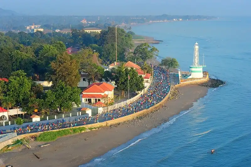 Entrants take part in the inaugural seven-kilometre inaugural City of Peace Run that was part of the Dili Marathon held 18 May 2011. Mid Caption: 70 Australian and New Zealand soldiers of the International Stabilisation Force (ISF) joined more than a 1000 local and international competitors in the first-ever Dili City of PeaceMarathon event in East Timor on 18 May 2011. Runners competed in three categories  the 42-kilometre Full Marathon, 21-kilometres Half Marathon and a 7-kilometre Run for Peace. Five ISF soldiers ran the full marathon, 14 competed in the half marathon while 51 entered the Run for Peace. Entrants in the Run for Peace included the President of Timor-Leste, Dr. Jose Ramos-Horta and Commander of the ISF, Colonel Mick Reilly. The ISF is in the country at the invitation of the Government of Timor-Leste to support East Timorese security forces to maintain a secure and stable environment. Photo by Corporal Melina Mancuso 1st Joint Public Affairs Unit