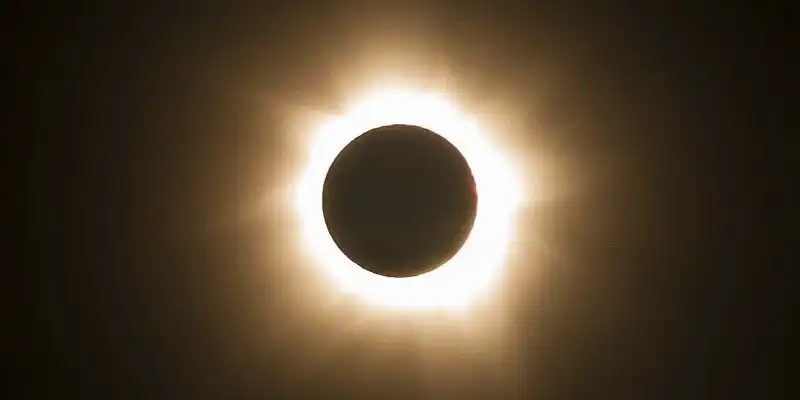 In this photo provided by Tourism Queensland, the moment of a total solar eclipse is observed at Cape Tribulation in Queensland state, Australia, Wednesday, Nov. 14, 2012. Starting just after dawn, the eclipse cast its 150-kilometer (95-mile) shadow in Australia's Northern Territory, crossed the northeast tip of the country and was swooping east across the South Pacific, where no islands are in its direct path. (AP Photo/Tourism Queensland) EDITORIAL USE ONLY