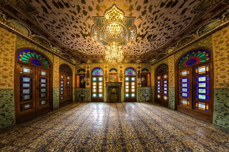 Emarat-e-Badgir (Windward Edifice) is one of the buildings in the Golestan Palace complex in Tehran, which dates back to Qajar era. This edifice has been the location for coronation of Mozaffar-e-Din Shah of Qajar. The building retains a windward on the top which clarifies the title. The exclusive ornaments of this building such as the glasses, the mirrors, and tall columns are of exceptional beauty. As soon as I entered the building of wind catchers,the first and the most important thing that got my attention,was glourious mirror works on the ceiling. Generally,when you think of a mirror,you see it as a tool which you can see yourself in it,that's why you find a mirror interesting and amusing. But when it combines with art,when it is divided into little pieces and placed next to each other artistically,it makes you to pay attention to the space and not yourself anymore. It's like the ceiling is a carpet made of mirrors which is seen all over the place.That is why it is so fantastic. This picture is showing a room inside this building.