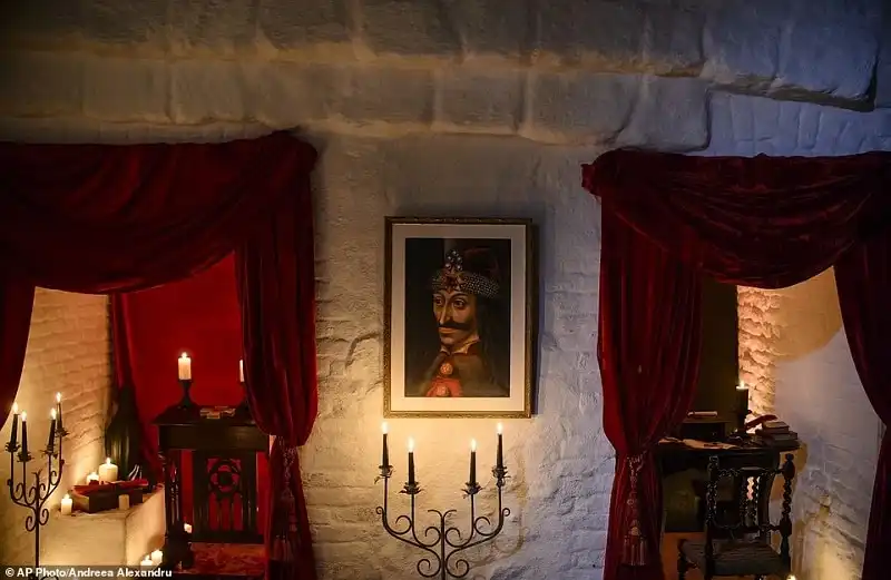 In this picture taken Oct. 9, 2016, a portrait of Vlad the Impaler is hung on a wall in Bran Castle, in Bran, Romania. Airbnb has launched a contest to find two people to stay overnight in the castle on Halloween, popularly known as Dracula’s castle because of its connection to the cruel real-life prince Vlad the Impaler, who inspired the legend of Dracula. (AP Photo/Andreea Alexandru)