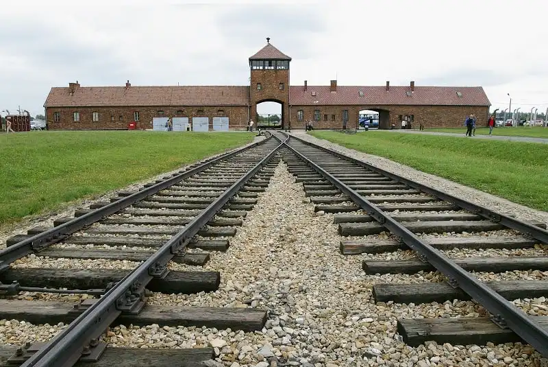 01 Jun 2003, Auschwitz, Poland --- Entrance to the infamous Auschwitz-Birkenau death camp which operated 4 gas chambers where 6,000 people were put to death each day by the Nazi regime. Nazi officers tried to burn documents and dismantle buildings and eradicate traces of gas chambers and crematoria. In 1947, the Polish Parliament set up the Auschwitz-Birkenau State Museum in Auschwitz I and Auschwitz II-Birkenau. --- Image by © Philippe Giraud/Good Look/Corbis
