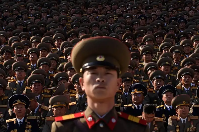 Bản đồ các nước trên thế giới và những cái nhất 10 A North Korean soldiers stands before spectators during a mass military parade at Kim Il-Sung square in Pyongyang on October 10, 2015. North Korea was marking the 70th anniversary of its ruling Workers' Party. AFP PHOTO / Ed Jones