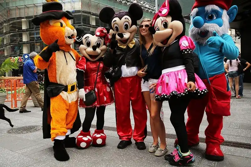 NEW YORK, NY - JULY 28: Costumed street performers pose with tourists for tips in Times Square on July 28, 2014 in New York City. In the latest incident involving the often aggressive characters, a man dressed as Spider-Man allegedly punched an officer in the face over the weekend following a dispute with a woman over a tip, police have said. The Times Square Alliance is now calling for strict licensing of costumed street performers. (Photo by Spencer Platt/Getty Images)