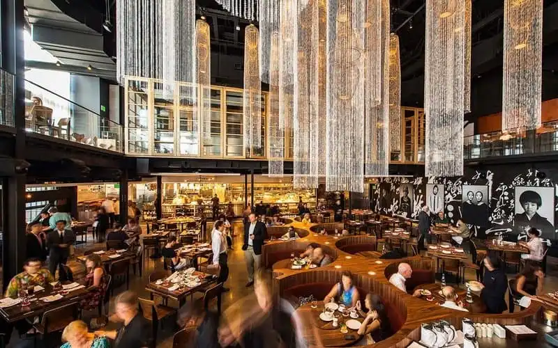 Chef Masaharu Morimoto and Patina Restaurant Group opened the doors to Morimoto Asia Sept. 30, 2015 at the newly named Disney Springs – the entertainment-dining-retail district re-imagined from Downtown Disney. Studio V’s design for Morimoto Asia features a continuous white bar ribboning through the restaurant, enveloping the industrial space to create Morimoto Asia, located at The Landing in the heart of Disney Springs. Morimoto Asia is the Japanese master chef’s first pan-Asian dining experience. (Matt Stroshane, photographer).
