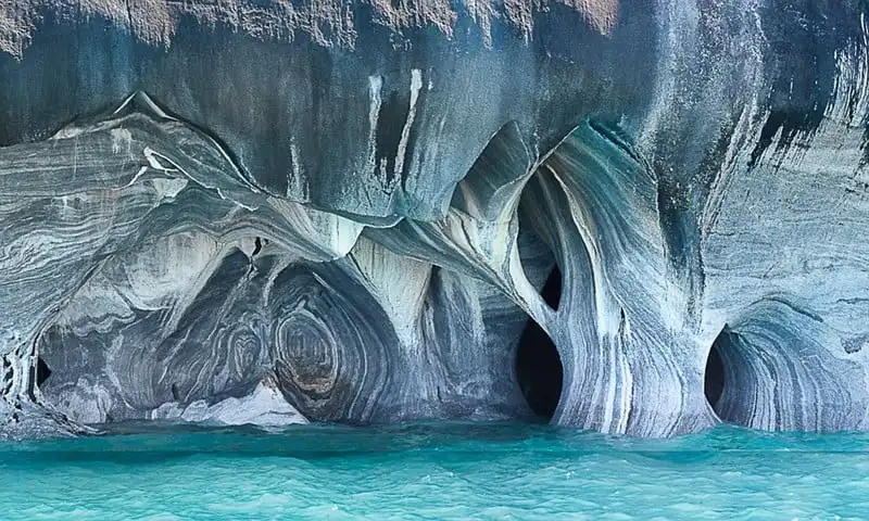 ***EXCLUSIVE***  PATAGONIA, CHILE - UNDATED: GV of Lake General Carrera in Patagonia, Chile.  Welcome to the Marble Cathedral - a natural wonder that could be the worlds most beautiful cave network. Like an azure temple created by nature, the walls of this network of water-filled marble caverns show just how magnificent the precious geography of our planet can be. Visitors to the water-sculptured blue caverns experience an incredible display of light, which is so rich thanks to the way the incredible sky of Patagonia is reflected into the waters of South Americas second largest freshwater lake, General Carrera. The light from the water bounces into the caverns and strikes the strangely carved marble walls, creating this enchanting lightshow. The incredible set of pictures has been captured by talented landscape photographer and environmentalist, Linde Waidehofer, 67, from Colorado in the USA. It is the water that formed the sinuous shapes of the marble walls - these waters are magic explained Linde in her book on the caverns, Blue Light. To reach this remote place located in the far southern tip of Chile visitors must fly from the capital, Santiago 1,200 miles to the nearest large city, Coyhaique and then drive 130 miles on challenging dirt roads south to the lake.   PHOTOGRAPH BY Linde Waidehofer / Barcroft Media  UK Office, London. T +44 845 370 2233 W www.barcroftmedia.com  USA Office, New York City. T +1 212 564 8159 W www.barcroftusa.com  Indian Office, Delhi. T +91 11 4101 1726 W www.barcroftindia.com  Australasian & Pacific Rim Office, Melbourne. E info@barcroftpacific.com T +613 9510 3188 or +613 9510 0688 W www.barcroftpacific.com