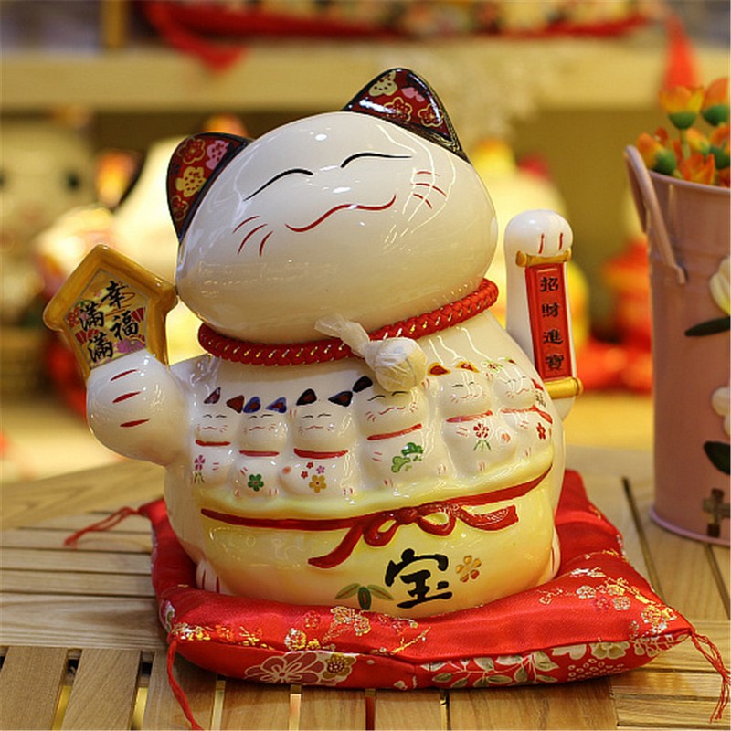 tạp chí wanderlust tips mèo maneki neko ở Nhật Bản